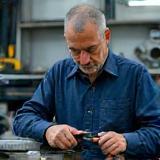 Emre Ada at work in the car repair workshop